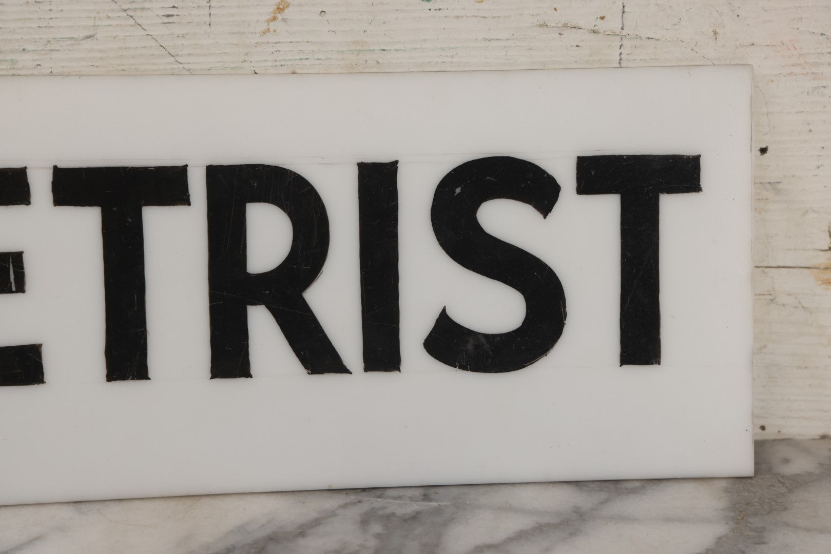 Lot 011 - Vintage Hand-Painted "Optometrist" Trade Sign On White Plexiglass, 23-1/2" x 6"