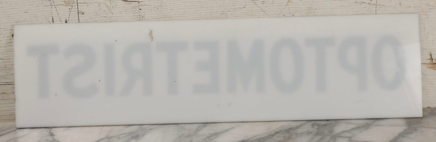 Lot 011 - Vintage Hand-Painted "Optometrist" Trade Sign On White Plexiglass, 23-1/2" x 6"