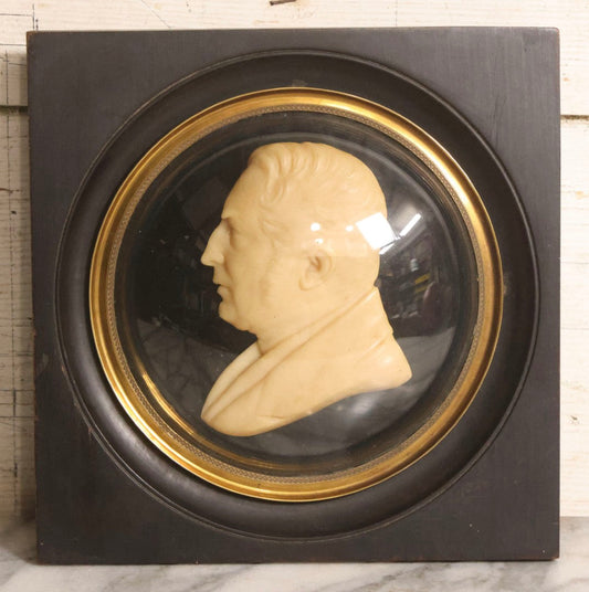 Lot 022 - Antique Wax Portrait Relief Of Gentleman Signed G. Grütter, Mounted On Reverse-Painted Glass Under Convex Dome, Continental, Circa 1830–1845, 10-3/8" x 10-1/2"