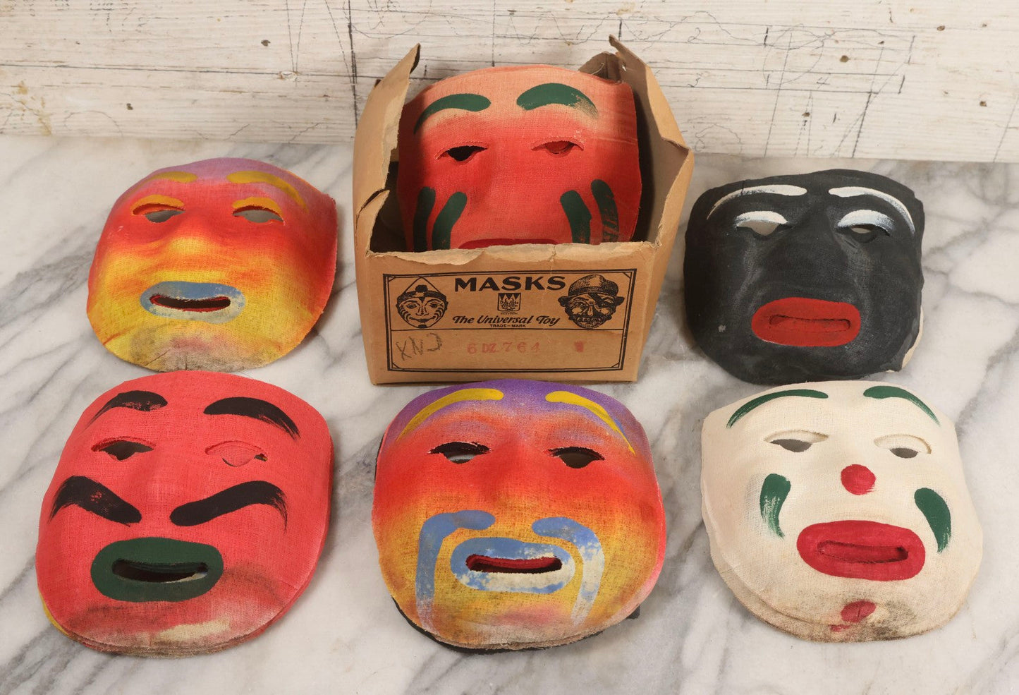 Lot 024 - Grouping Of 50 Vintage New Old Stock N.O.S. Gauze Clown Halloween Masks In Original Des Arts Products Box, No. 764, "Masks, The Universal Toy"