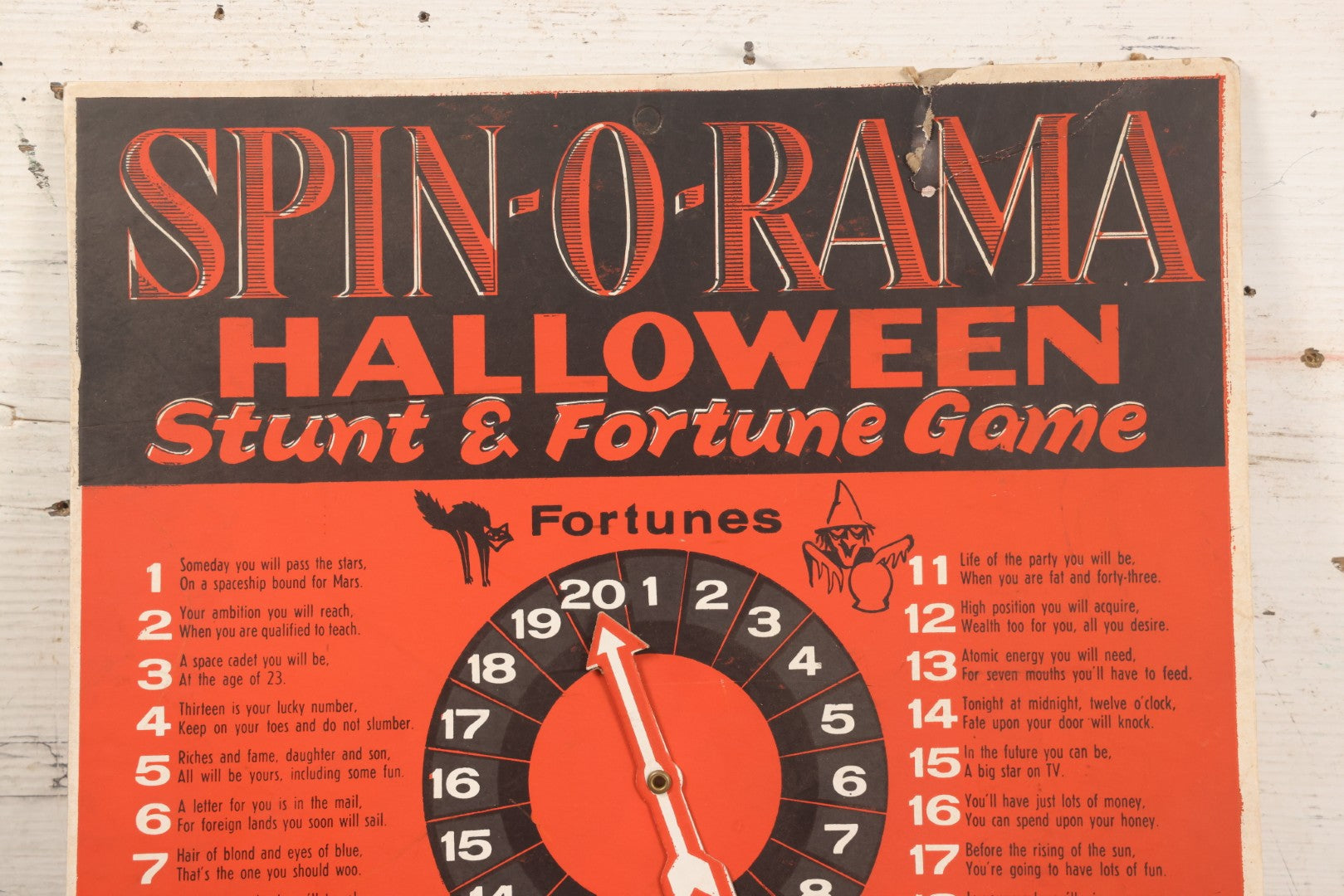 Lot 025 - Vintage Spin-O-Rama Halloween Stunt And Fortune Game By Beistle With Witch, Black Cat, And Jack-O-Lantern J.O.L. Graphics, Made In U.S.A.., 12-3/8" x 18-3/8"