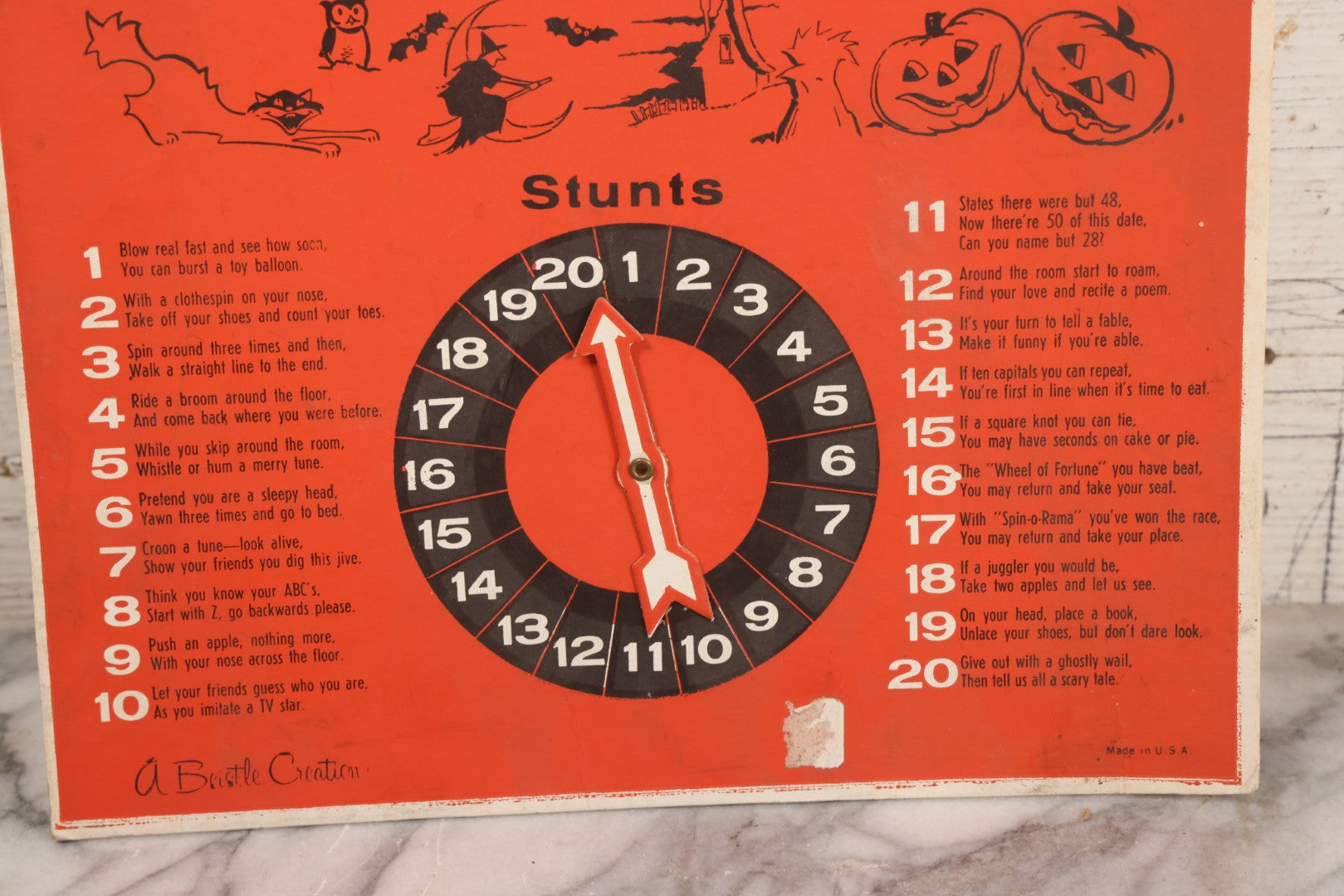 Lot 025 - Vintage Spin-O-Rama Halloween Stunt And Fortune Game By Beistle With Witch, Black Cat, And Jack-O-Lantern J.O.L. Graphics, Made In U.S.A.., 12-3/8" x 18-3/8"