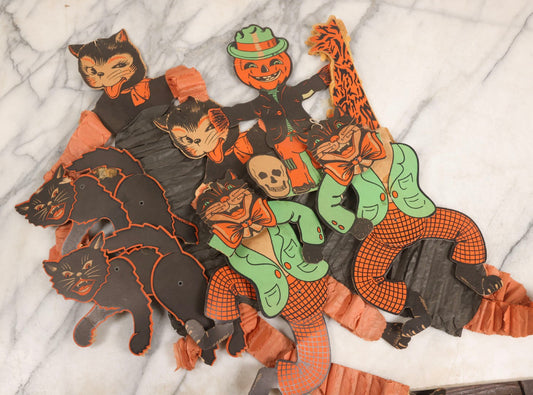 Lot 027 - Grouping Of Seven Vintage Die-Cut Halloween Decorations For Craft Or Restoration Including Jointed And Accordion Cats And Jack-O-Lantern J.O.L. Scarecrow With Skull