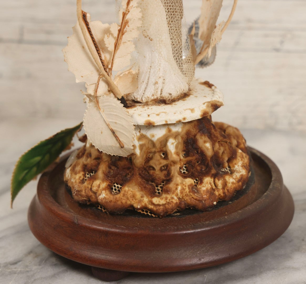 Lot 035 - Vintage Wwii Era Servicemember Wedding Cake Topper In Glass Dome Cloche With Bride, Groom In Military Uniform, Faux White Flowers, And Wood Base, 9-1/2" H