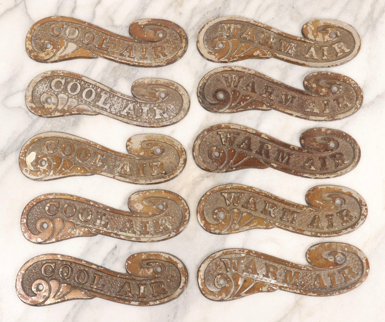 Lot 045 - Grouping Of Ten Vintage Cast Metal Air Register Badges With Scroll Design — Five “Cool Air” And Five “Warm Air”