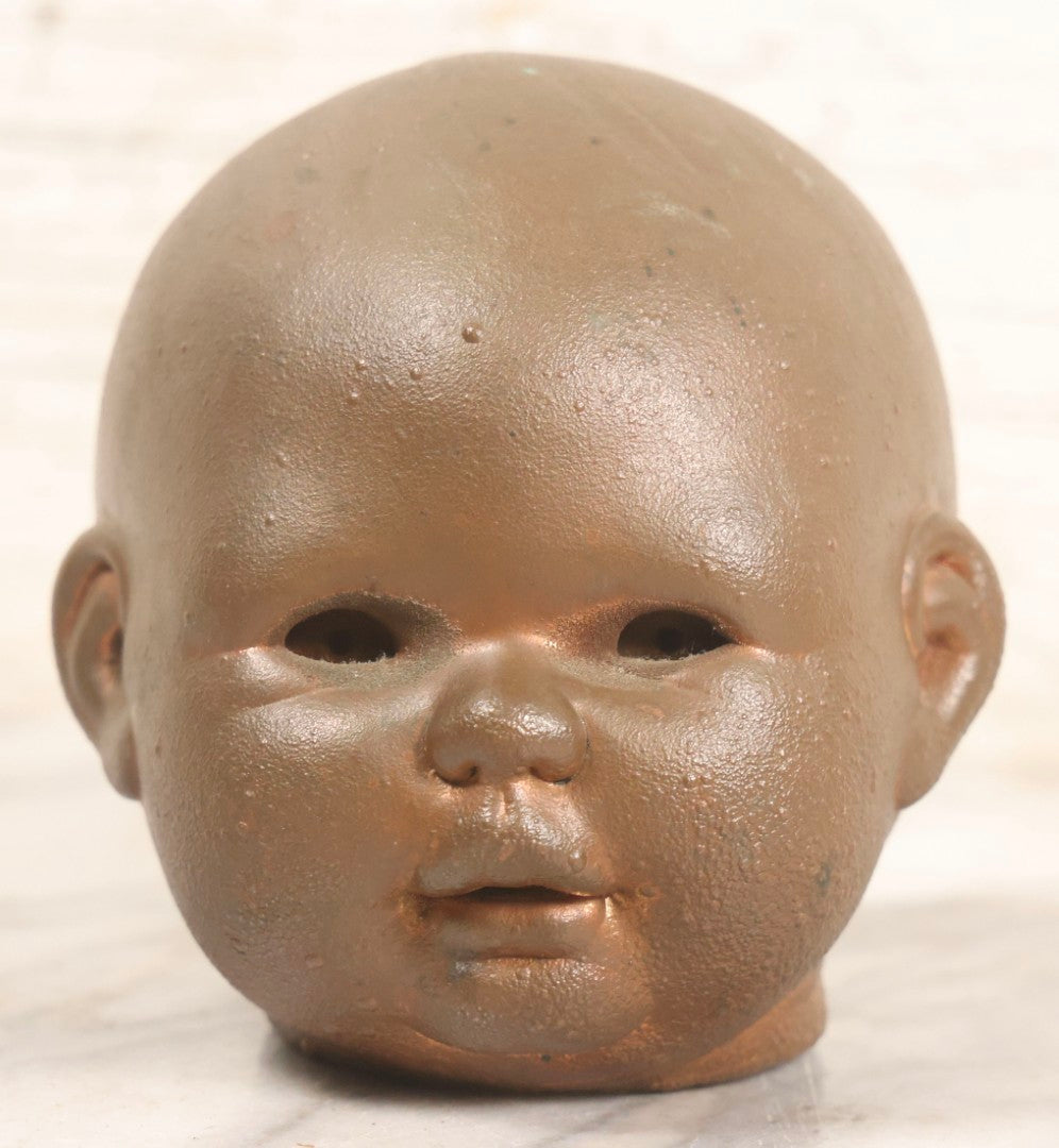 Lot 047 - Vintage Cast Metal Doll Head Mold With Bronze Finish, Likely For Rubber Head Doll Production