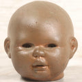 Lot 047 - Vintage Cast Metal Doll Head Mold With Bronze Finish, Likely For Rubber Head Doll Production