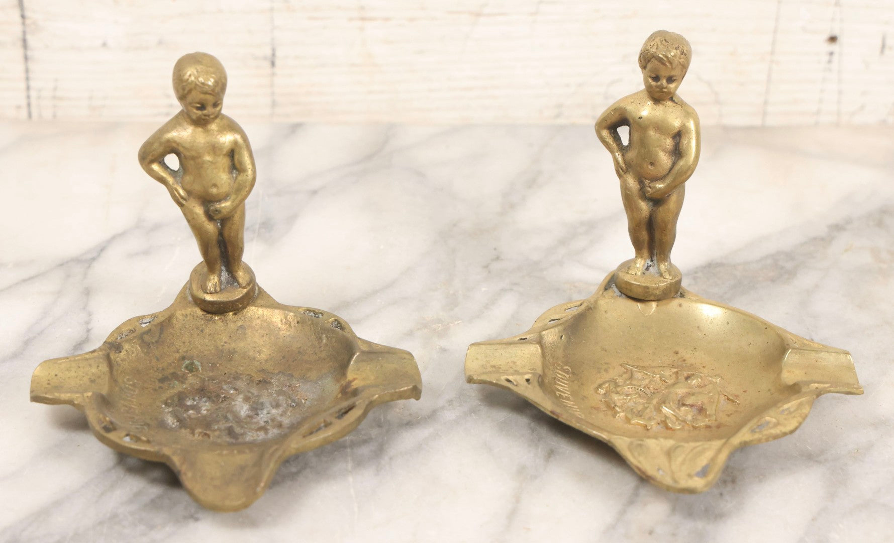 Lot 050 - Pair Of Vintage Cast Bronze "Souvenir De Bruxelles" Boy Ashtrays With Winged Herald And Dragon Motif, 3-5/8" H Each