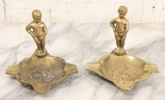 Lot 050 - Pair Of Vintage Cast Bronze "Souvenir De Bruxelles" Boy Ashtrays With Winged Herald And Dragon Motif, 3-5/8" H Each