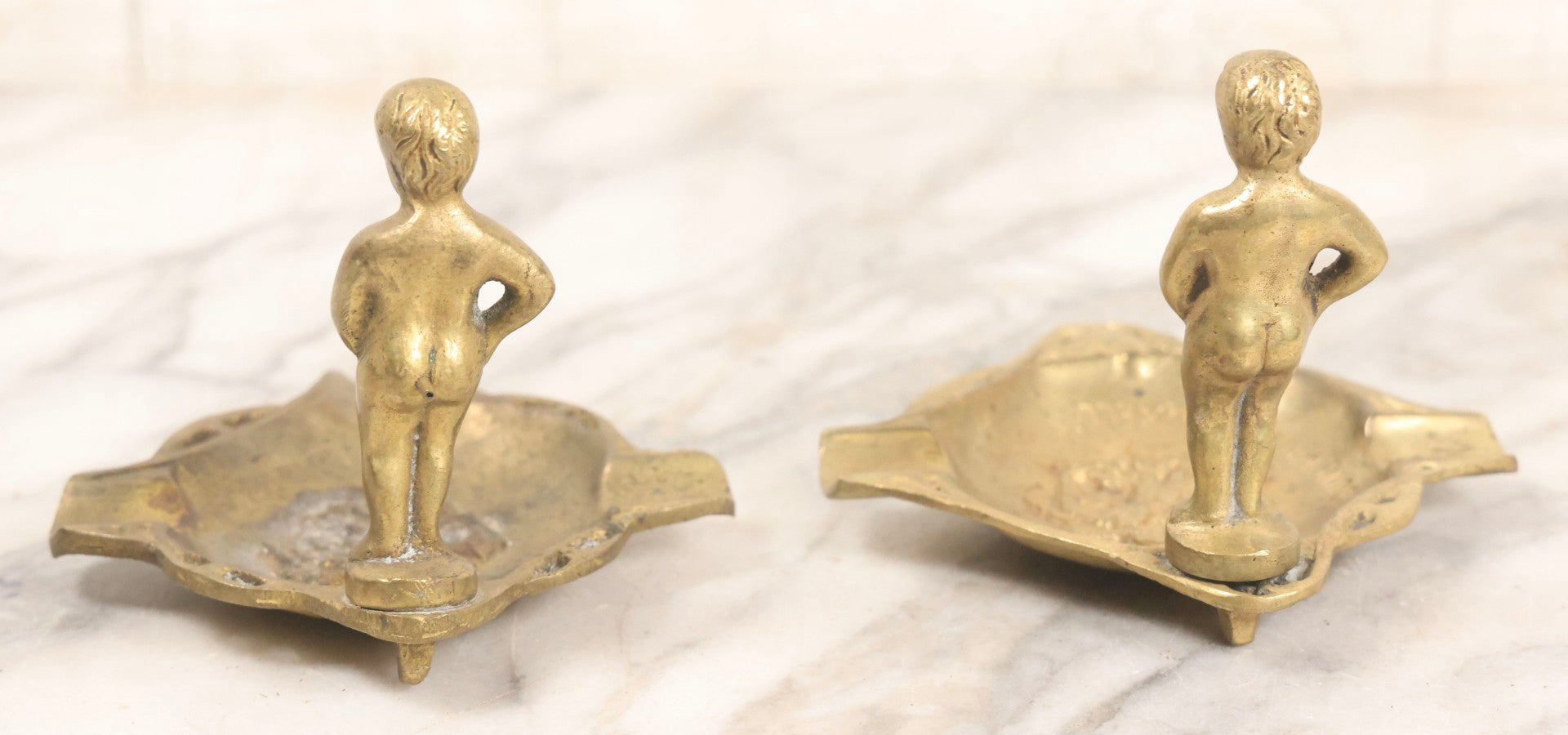 Lot 050 - Pair Of Vintage Cast Bronze "Souvenir De Bruxelles" Boy Ashtrays With Winged Herald And Dragon Motif, 3-5/8" H Each