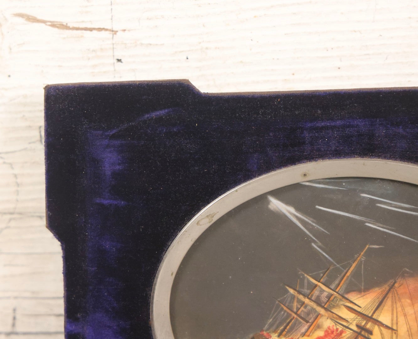 Lot 055 - Antique Hand-Colored Engraving Of Ship On Fire In Storm With Lightning, In Victorian Purple Velvet Frame With Silver Metal Surround, 8-1/2" x 6-1/2"