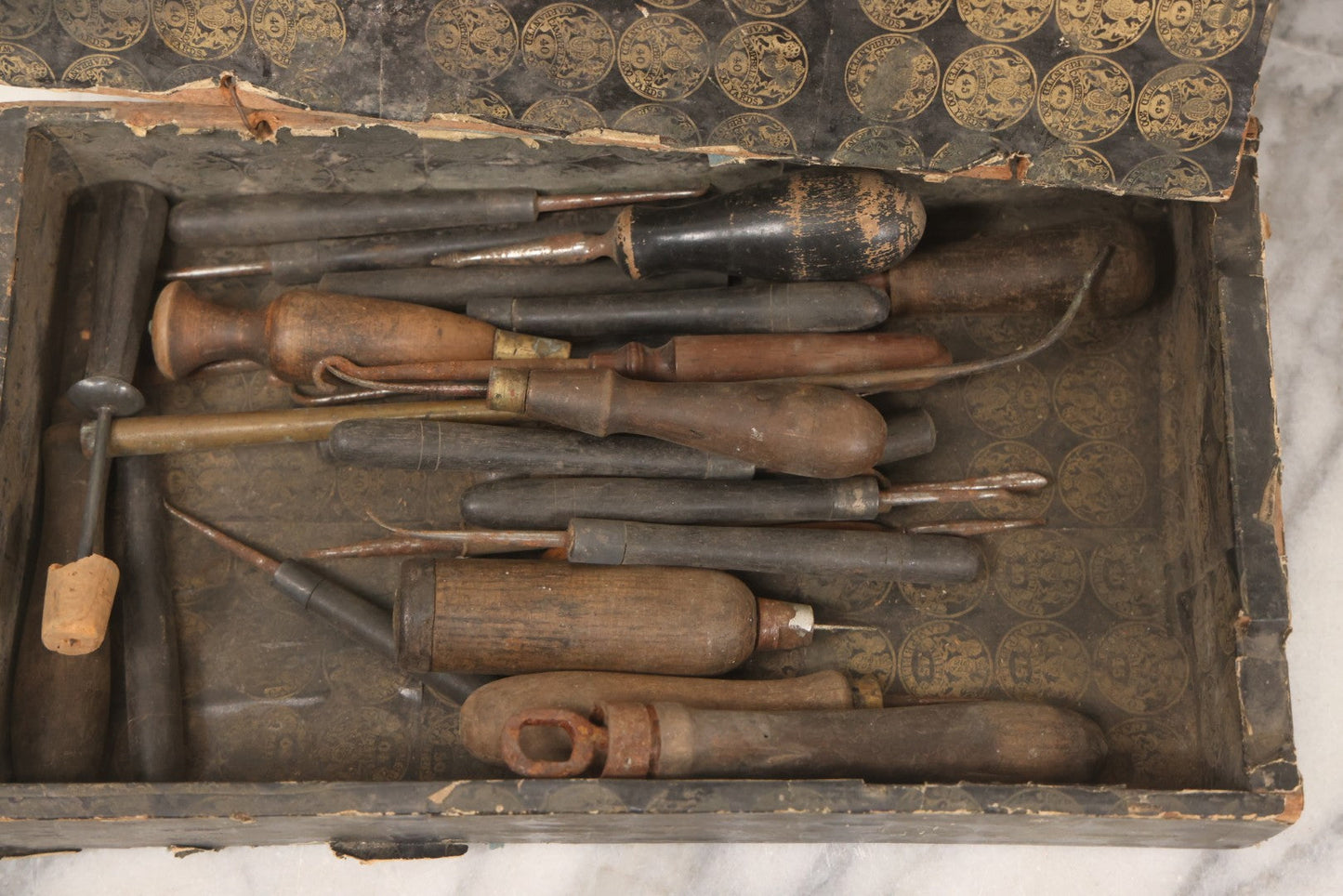 Lot 075 - Antique Make-Do Paper-Covered Wooden Textile Worker Tool Box With Campbell & Co. Thread Labels, Containing 20+ Wood Handled Awls