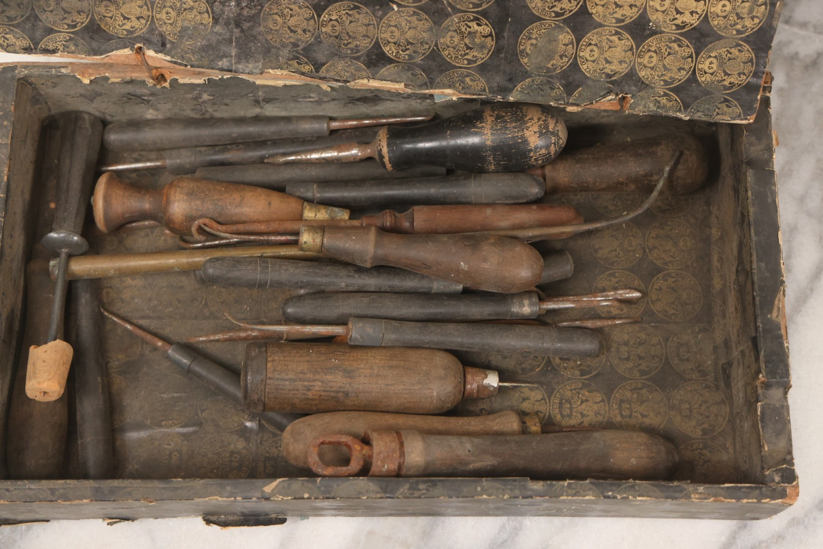 Lot 075 - Antique Make-Do Paper-Covered Wooden Textile Worker Tool Box With Campbell & Co. Thread Labels, Containing 20+ Wood Handled Awls