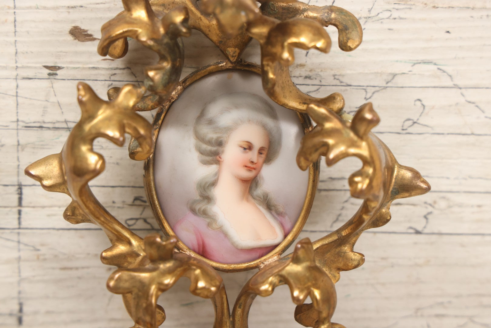Lot 076 - Antique Hand Painted Porcelain Tile Of White-Haired Woman In Pink Dress In Ornate Ormolu Frame, A.M.W., 24Kt Gold Plate, Note Frame Damage, Repairs, 4-3/4" x 5-3/4"