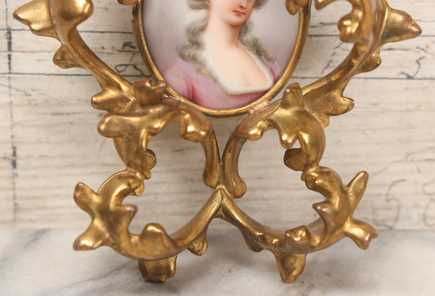 Lot 076 - Antique Hand Painted Porcelain Tile Of White-Haired Woman In Pink Dress In Ornate Ormolu Frame, A.M.W., 24Kt Gold Plate, Note Frame Damage, Repairs, 4-3/4" x 5-3/4"