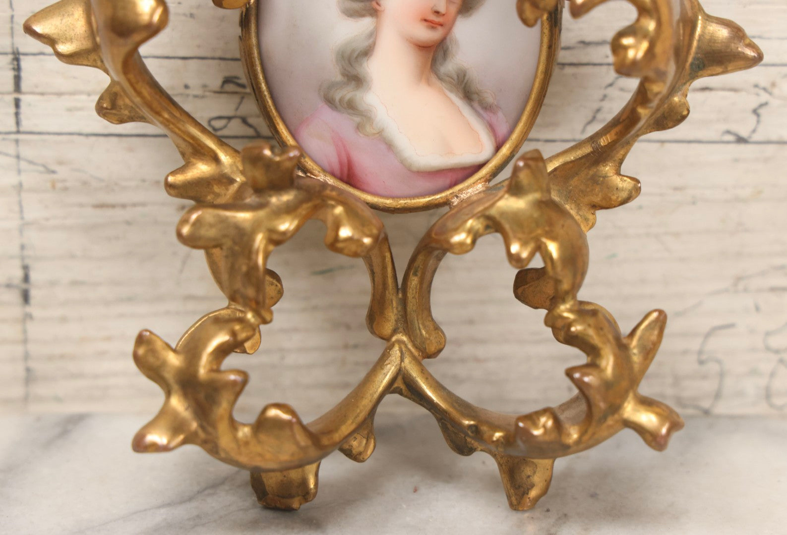Lot 076 - Antique Hand Painted Porcelain Tile Of White-Haired Woman In Pink Dress In Ornate Ormolu Frame, A.M.W., 24Kt Gold Plate, Note Frame Damage, Repairs, 4-3/4" x 5-3/4"