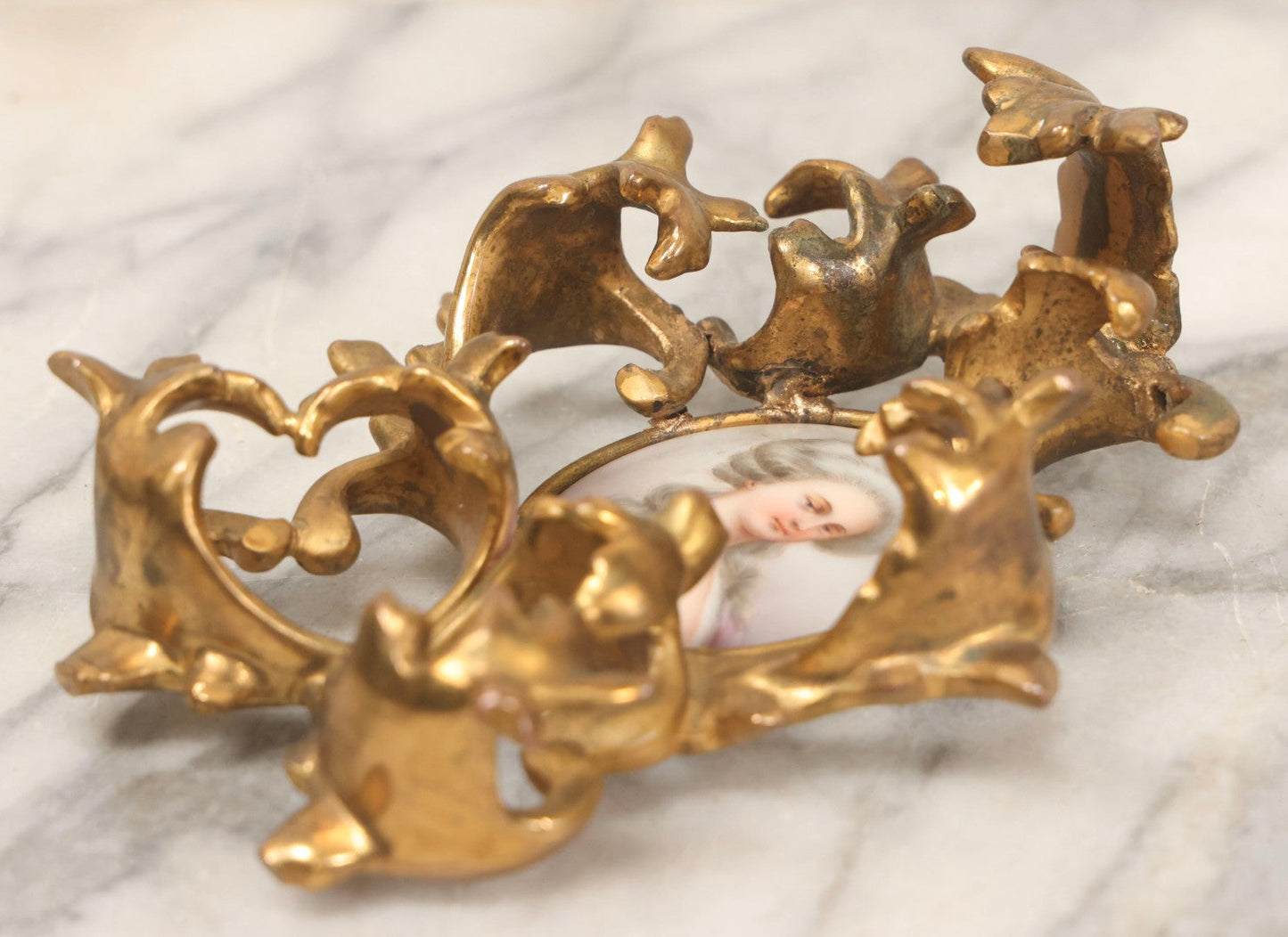 Lot 076 - Antique Hand Painted Porcelain Tile Of White-Haired Woman In Pink Dress In Ornate Ormolu Frame, A.M.W., 24Kt Gold Plate, Note Frame Damage, Repairs, 4-3/4" x 5-3/4"