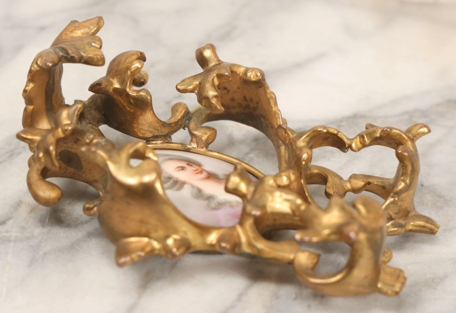 Lot 076 - Antique Hand Painted Porcelain Tile Of White-Haired Woman In Pink Dress In Ornate Ormolu Frame, A.M.W., 24Kt Gold Plate, Note Frame Damage, Repairs, 4-3/4" x 5-3/4"