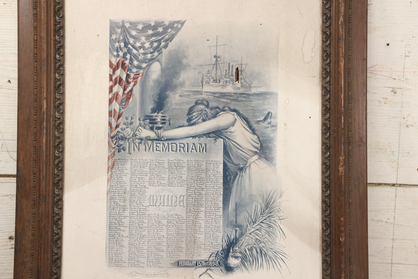 Lot 078 - Antique Commemorative Mourning Print "In Memoriam" Of The Sinking Of The Maine, February 15, 1898, With Original Frame, List Of Deceased, Note No Glass, Poor Condition, 17-7/8" x 21-7/8"