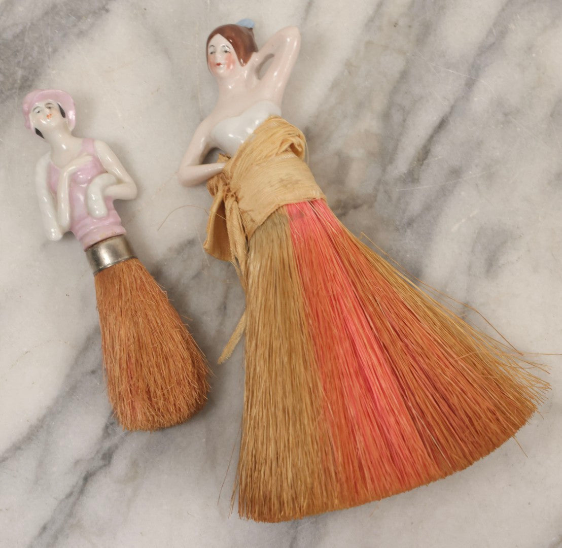 Lot 081 - Pair Of Vintage Porcelain Dresser Brushes With Straw Bristles, German Made, Featuring Woman In White Dress And Flapper Girl With Fur Boa
