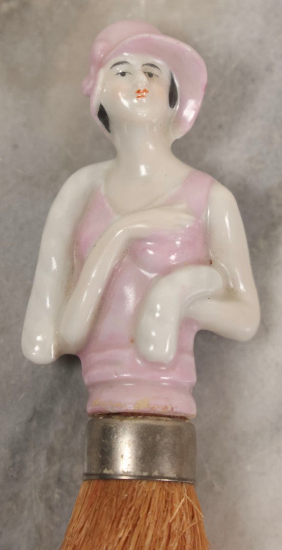 Lot 081 - Pair Of Vintage Porcelain Dresser Brushes With Straw Bristles, German Made, Featuring Woman In White Dress And Flapper Girl With Fur Boa