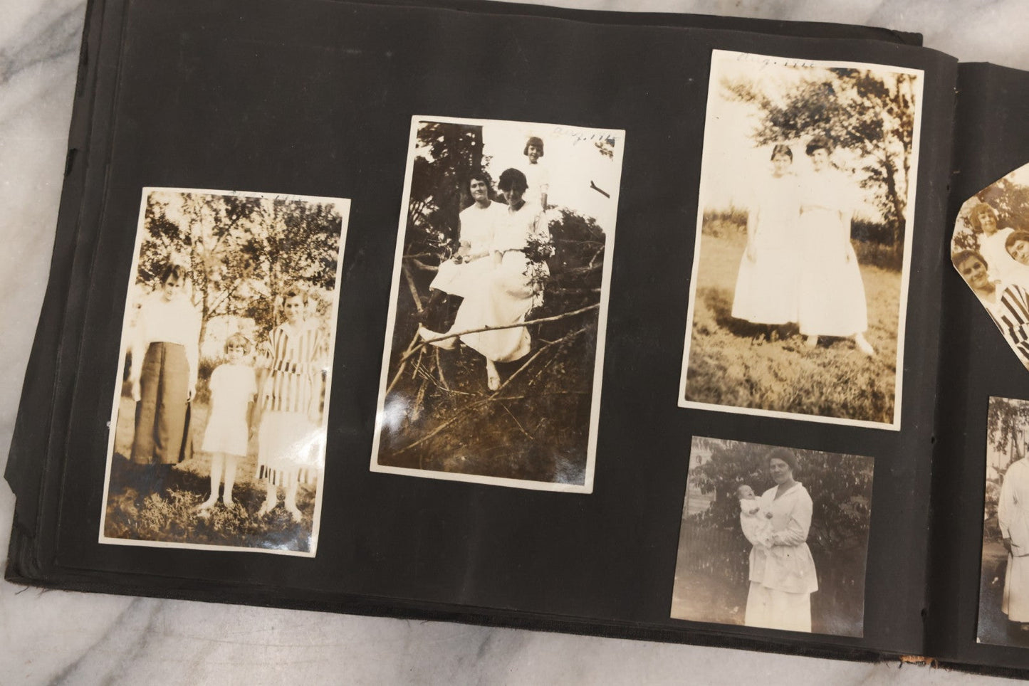 Lot 097 - Antique Snapshot Photograph Album With 225+ Photos Of Rural Life In Kansas, Including Adventuring Teenage Girls, Croft Schoolchildren, Wwi Soldiers, And Burning Of Croft Depot, Circa 1910–1920