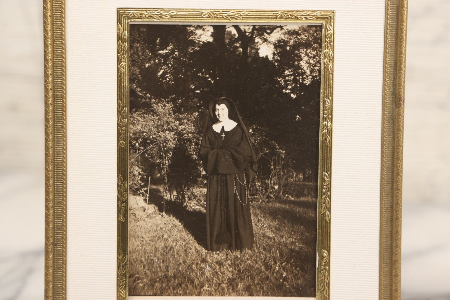 Lot 104 - Vintage Framed Photograph Of Smiling Nun In Backyard, Pressed Brass Frame, 5-1/2" x 6-7/8"