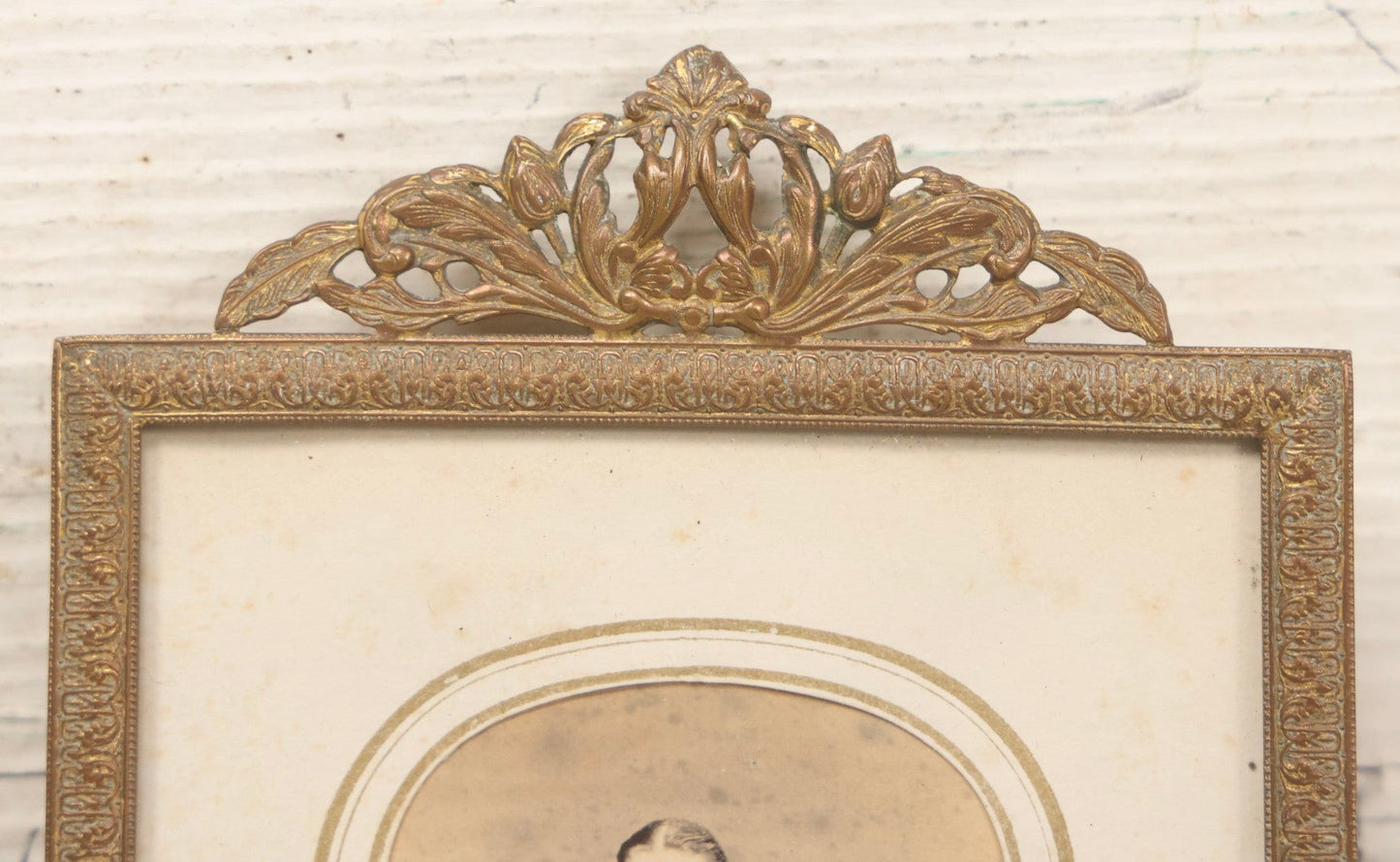 Lot 105 - Antique Carte De Visite C.D.V.. Photograph Of Teenage Girl In Checkered Dress In Brass Tin Frame With Floral Crest And Hanging Loop, 4-3/8" x 6-7/8"