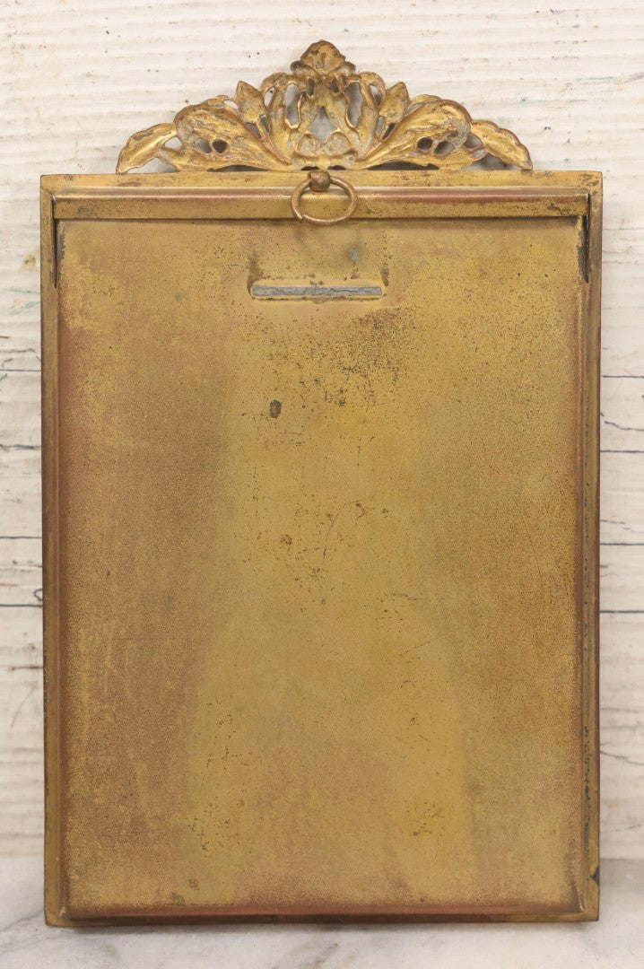 Lot 105 - Antique Carte De Visite C.D.V.. Photograph Of Teenage Girl In Checkered Dress In Brass Tin Frame With Floral Crest And Hanging Loop, 4-3/8" x 6-7/8"