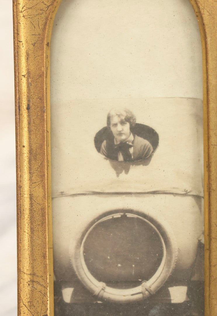 Lot 106 - Antique Framed Photograph Of Woman In Early Automobile With Spare Tire Visible, In Gold Painted Metal Pointed Arch Frame, 2-1/2" x 5"