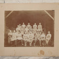 Lot 109 - Antique Boarded Occupational Photograph Of Lumberyard Workers In Work Clothes Posed Atop Stacked Lumber On Sawhorses Before Piles Of Wood