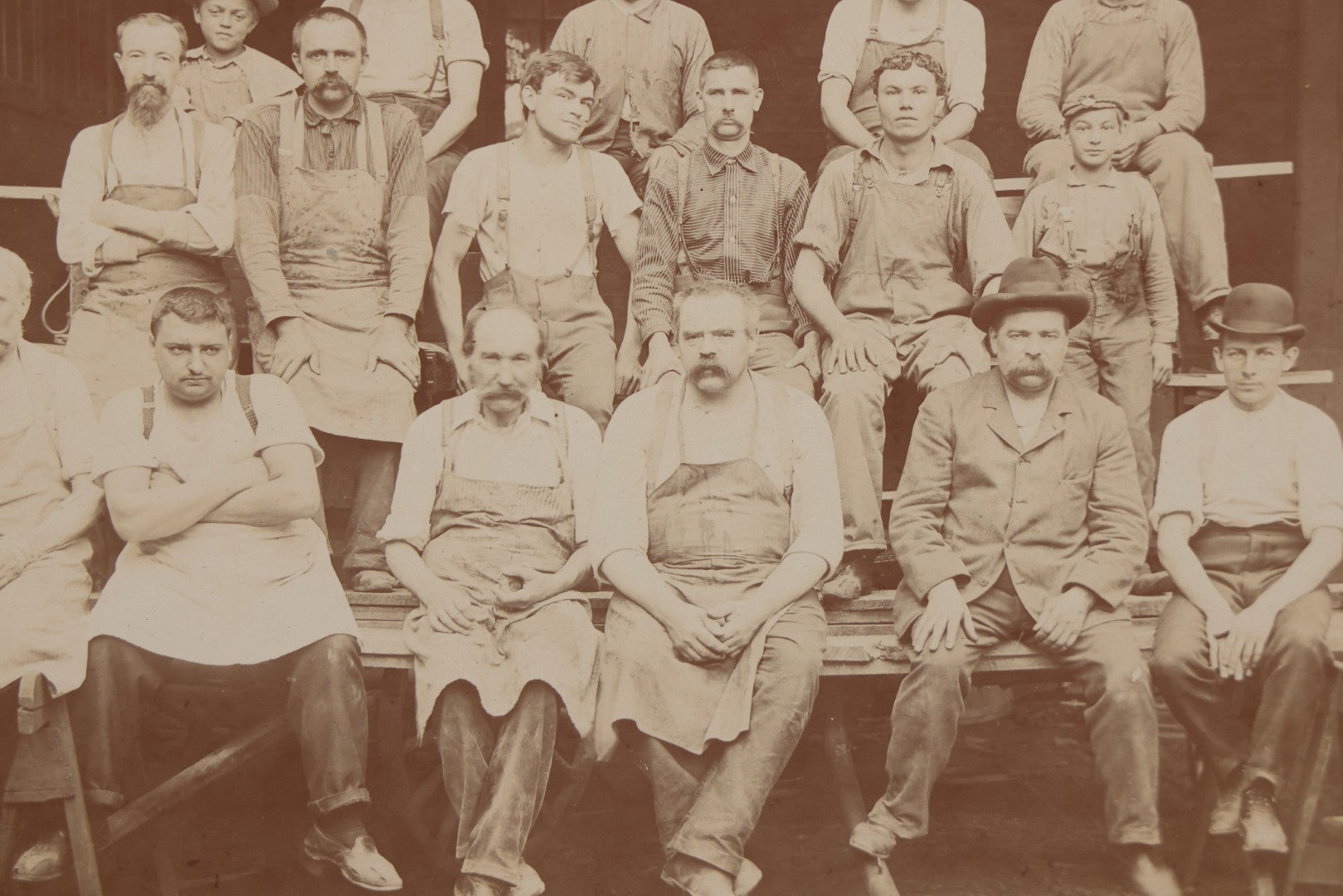 Lot 109 - Antique Boarded Occupational Photograph Of Lumberyard Workers In Work Clothes Posed Atop Stacked Lumber On Sawhorses Before Piles Of Wood