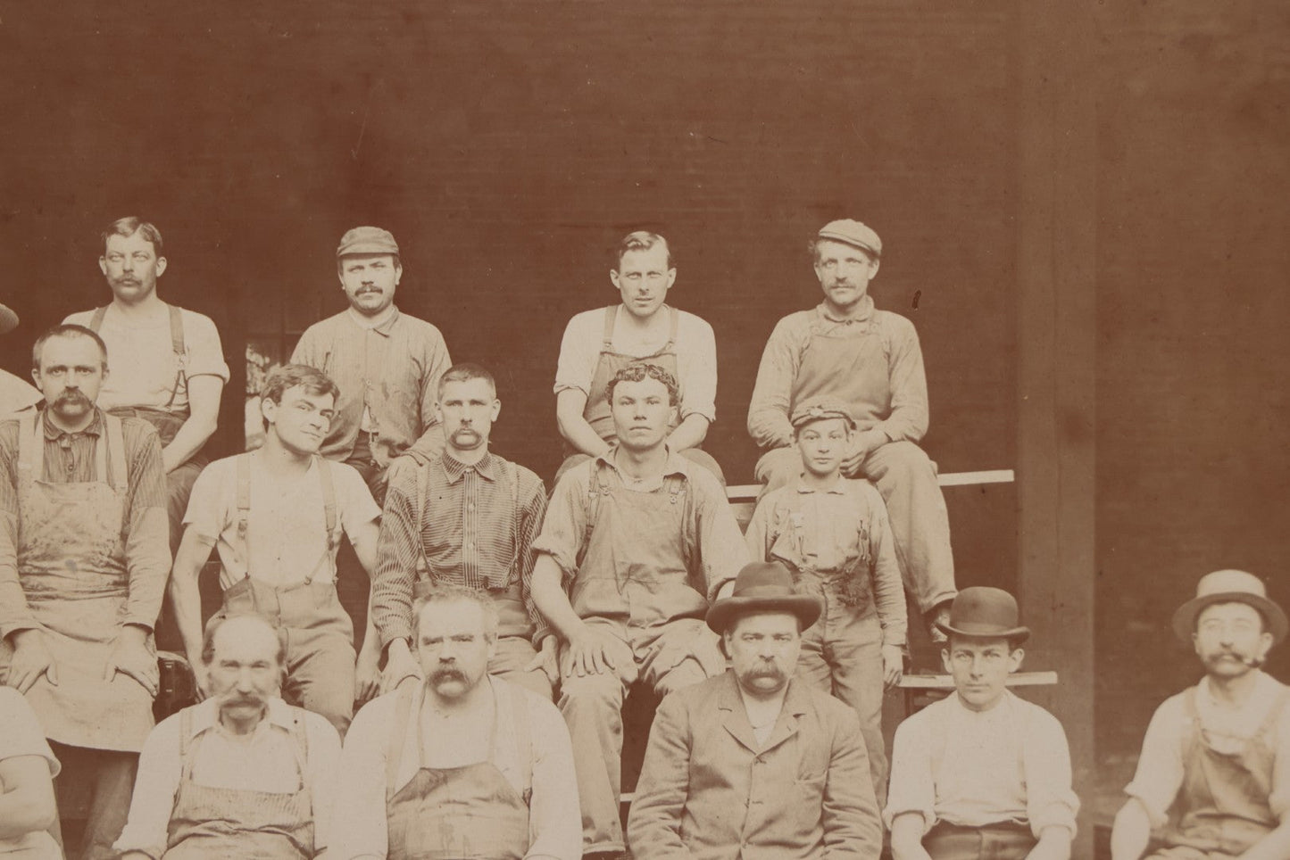 Lot 109 - Antique Boarded Occupational Photograph Of Lumberyard Workers In Work Clothes Posed Atop Stacked Lumber On Sawhorses Before Piles Of Wood