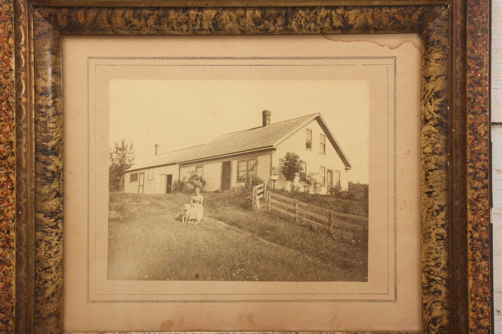 Lot 110 - Antique Boarded Photograph Of Woman Seated With Dog Before Farmhouse And Barn, In Faux Marble Painted Double Frame, 15-5/8" x 13-3/4"