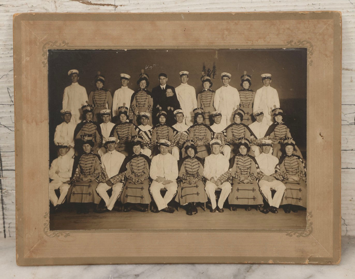 Lot 114 - Antique Boarded Group Photograph Of Men In Sailor Uniforms And Women In Marching Band Outfits