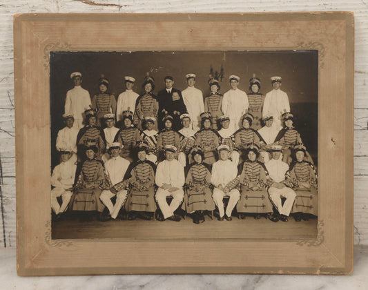 Lot 114 - Antique Boarded Group Photograph Of Men In Sailor Uniforms And Women In Marching Band Outfits