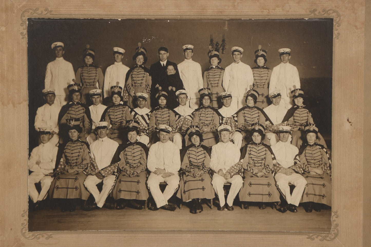Lot 114 - Antique Boarded Group Photograph Of Men In Sailor Uniforms And Women In Marching Band Outfits