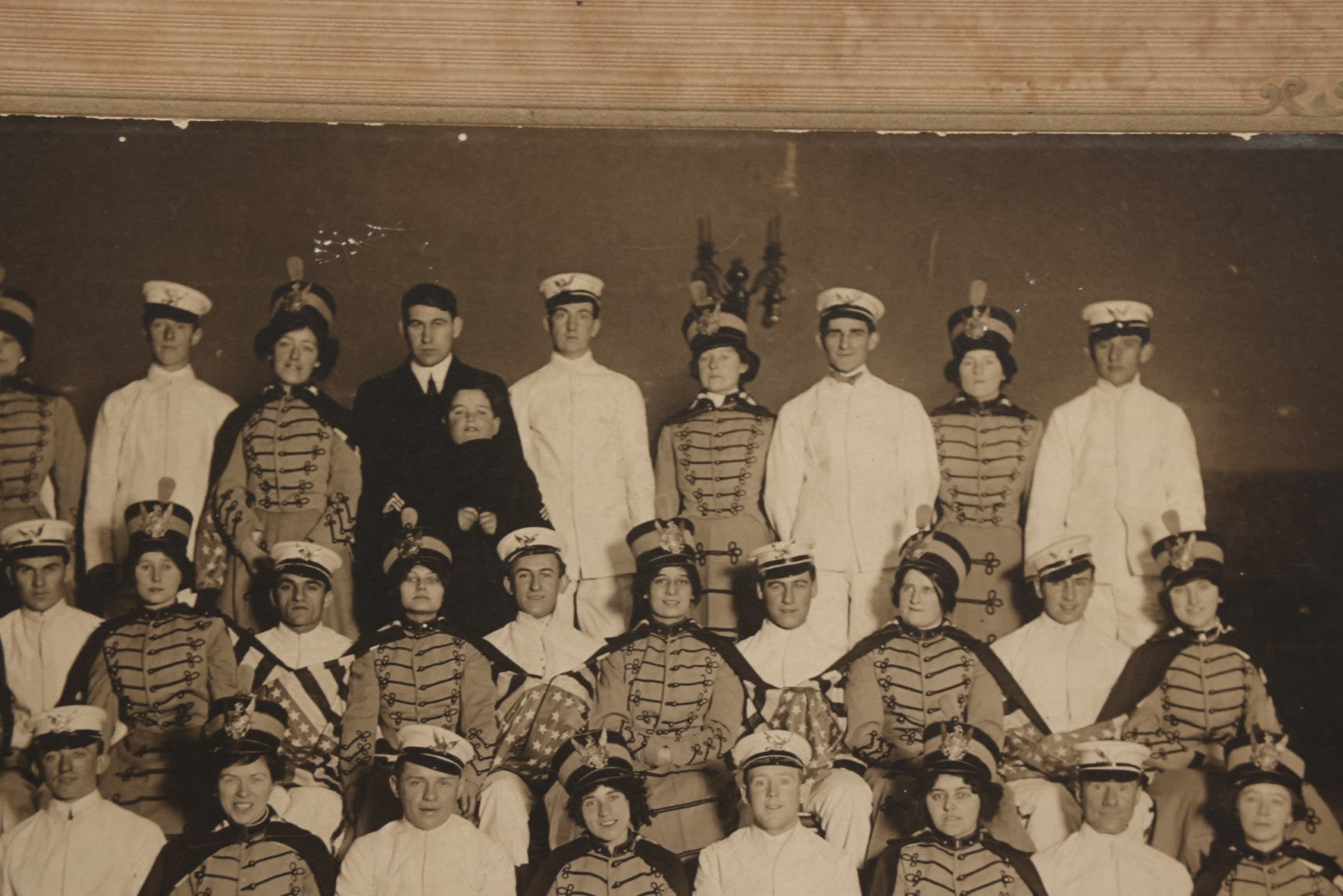 Lot 114 - Antique Boarded Group Photograph Of Men In Sailor Uniforms And Women In Marching Band Outfits