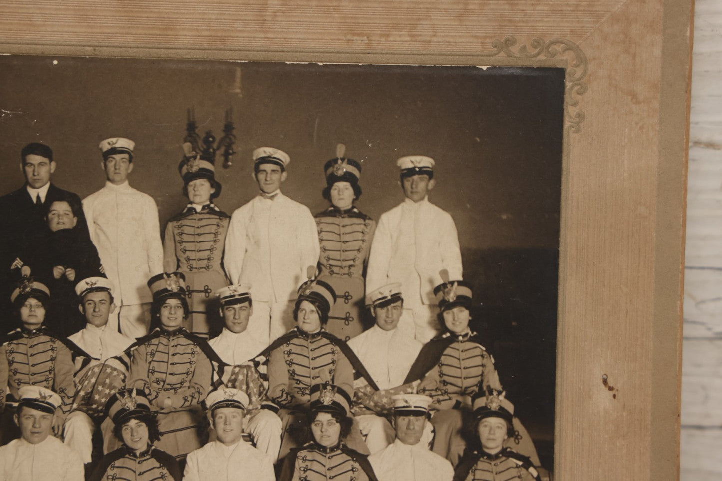 Lot 114 - Antique Boarded Group Photograph Of Men In Sailor Uniforms And Women In Marching Band Outfits