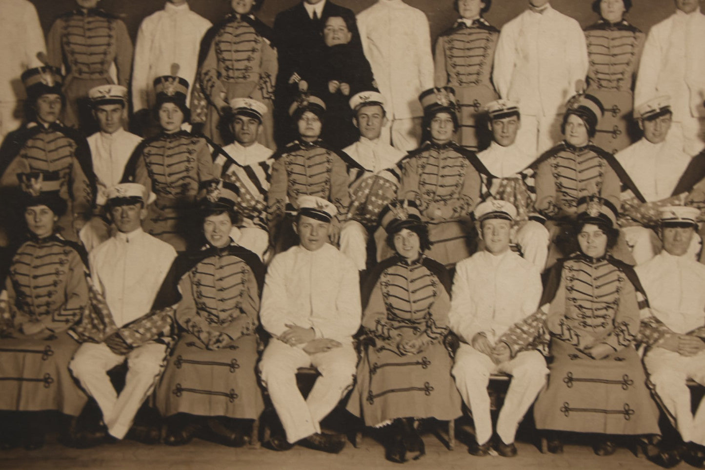 Lot 114 - Antique Boarded Group Photograph Of Men In Sailor Uniforms And Women In Marching Band Outfits