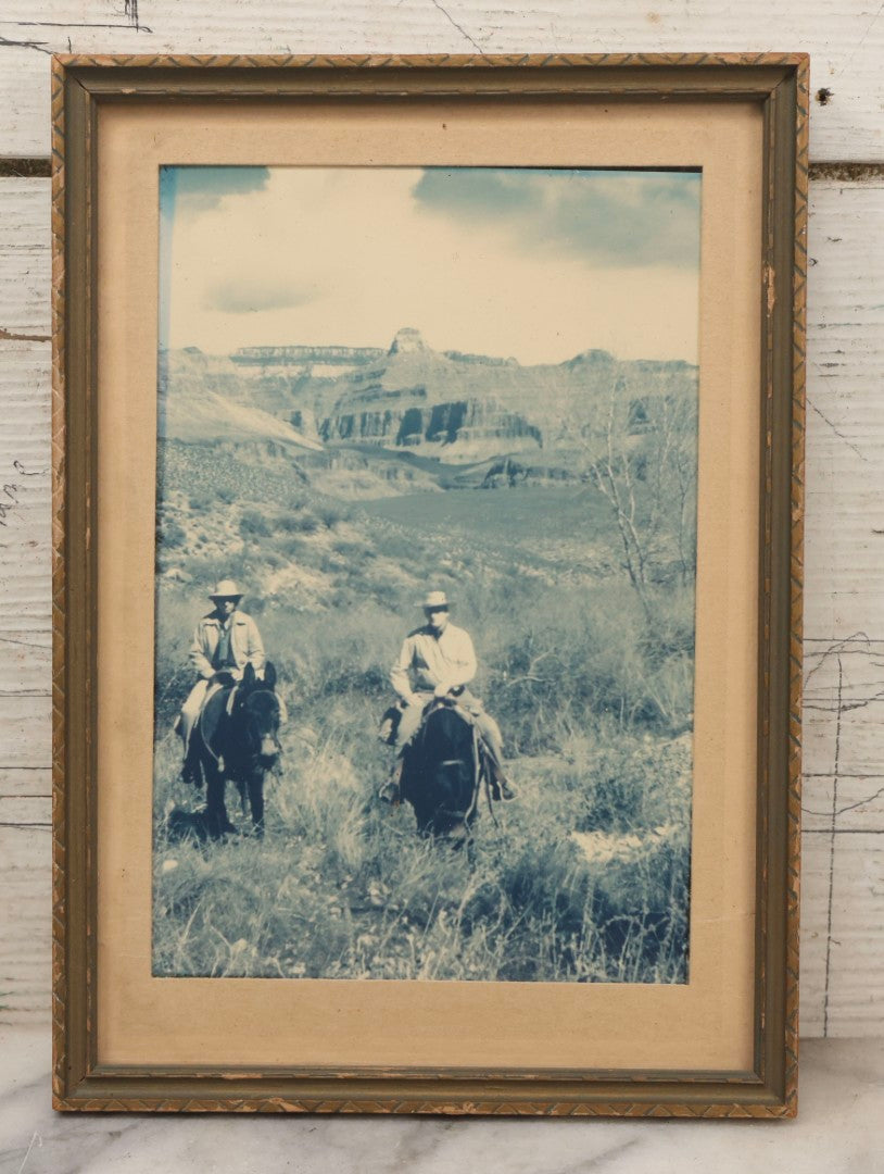 Lot 116 - Vintage Glossy Photograph Of Two Cowboys Riding Through Prairie Under Cloudy Sky, Framed, 6-7/8" x 9-5/8"