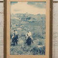 Lot 116 - Vintage Glossy Photograph Of Two Cowboys Riding Through Prairie Under Cloudy Sky, Framed, 6-7/8" x 9-5/8"