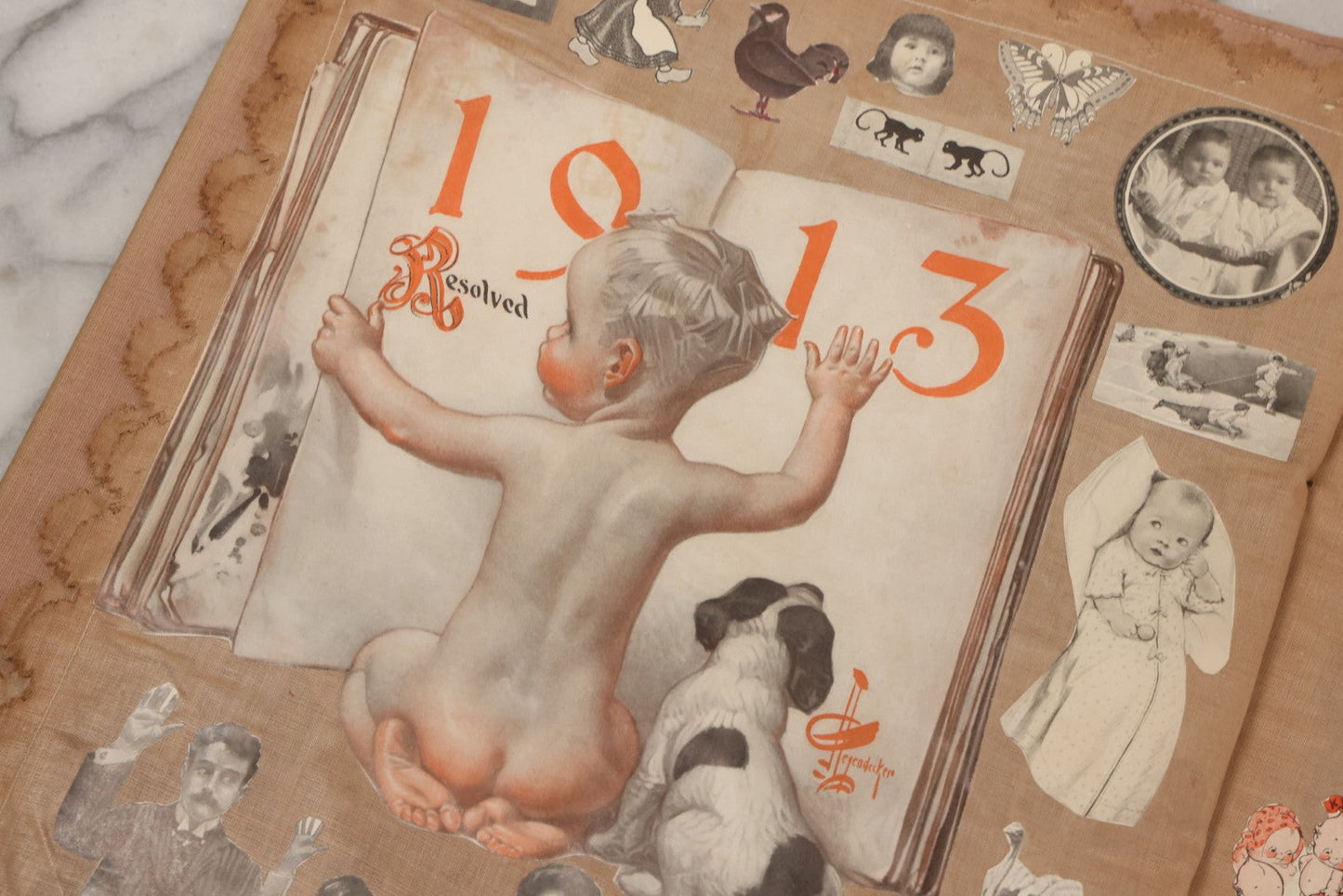 Lot 134 - Antique Linen Scrapbook With Fabric Pages Containing Over 100 Hand Cut Magazine Clippings Including Santa, Children, Animals, Kewpies, Women, Advertisements, And More Circa 1913