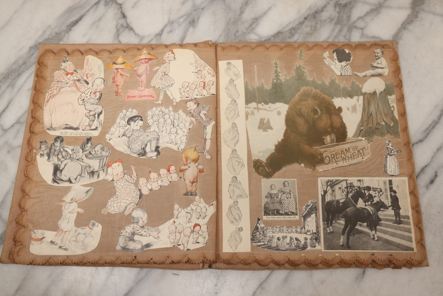 Lot 134 - Antique Linen Scrapbook With Fabric Pages Containing Over 100 Hand Cut Magazine Clippings Including Santa, Children, Animals, Kewpies, Women, Advertisements, And More Circa 1913
