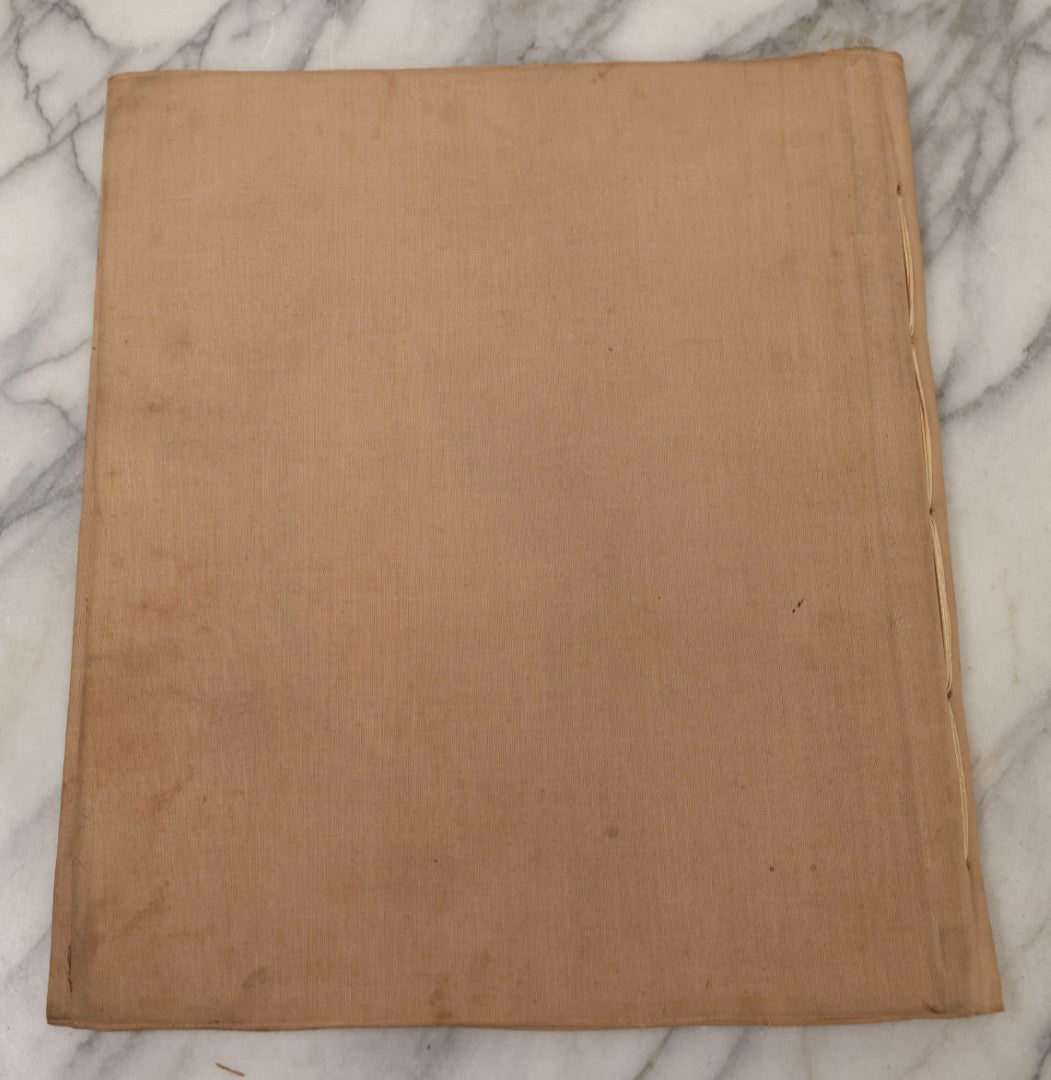 Lot 134 - Antique Linen Scrapbook With Fabric Pages Containing Over 100 Hand Cut Magazine Clippings Including Santa, Children, Animals, Kewpies, Women, Advertisements, And More Circa 1913