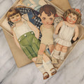 Lot 136 - Antique Box Lot Of Paper Dolls And Clothing, Including Hand Drawn Outfits And Mechanical "Susan" Doll By Sam'L Gabriel Sons & Company, Printed In Germany, 1919