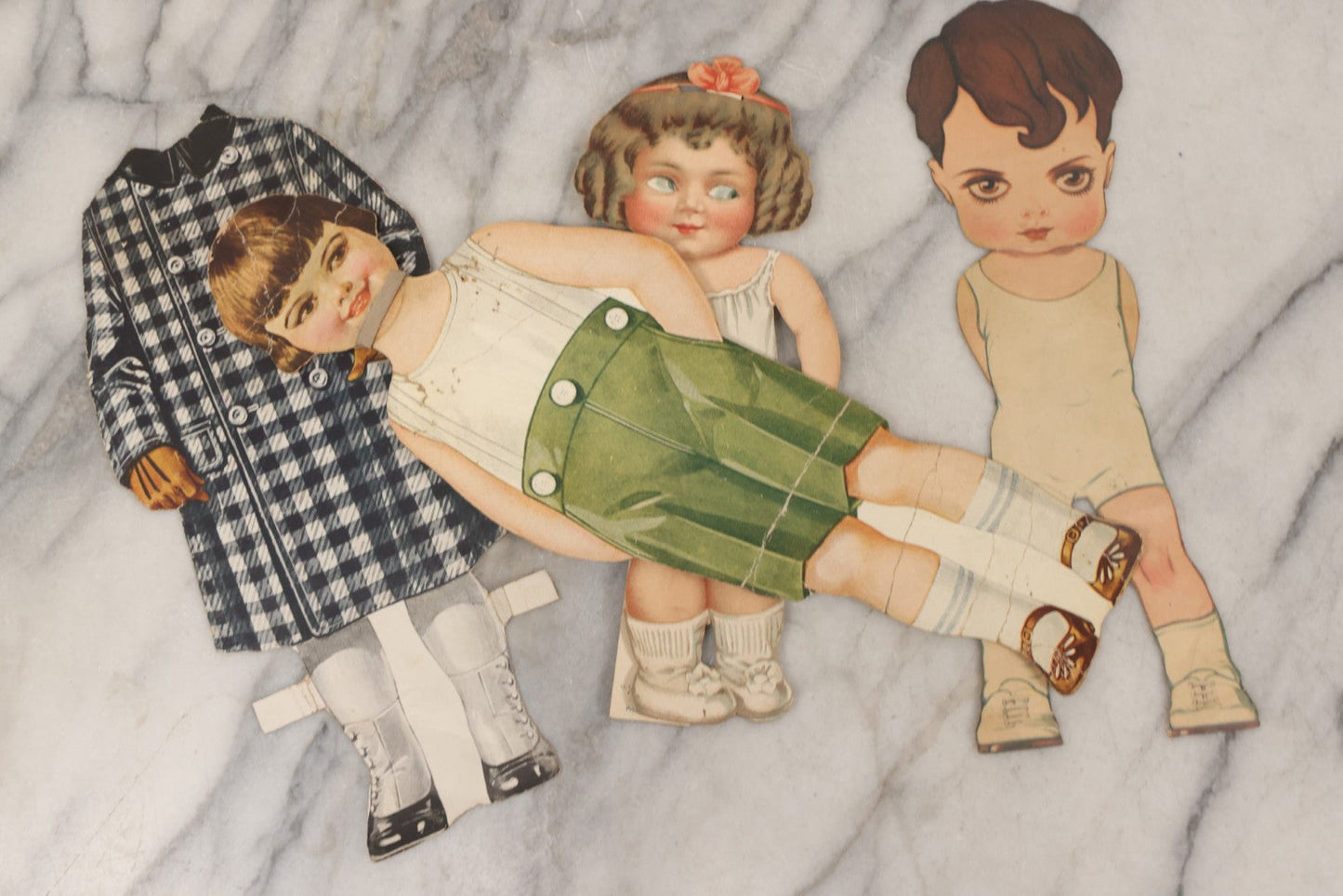 Lot 136 - Antique Box Lot Of Paper Dolls And Clothing, Including Hand Drawn Outfits And Mechanical "Susan" Doll By Sam'L Gabriel Sons & Company, Printed In Germany, 1919