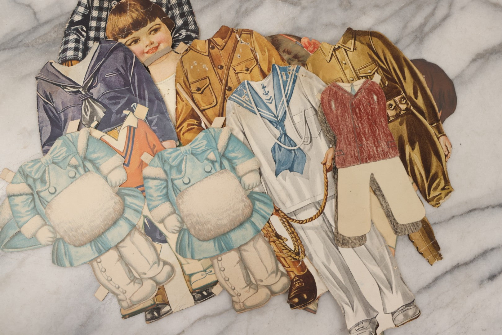 Lot 136 - Antique Box Lot Of Paper Dolls And Clothing, Including Hand Drawn Outfits And Mechanical "Susan" Doll By Sam'L Gabriel Sons & Company, Printed In Germany, 1919