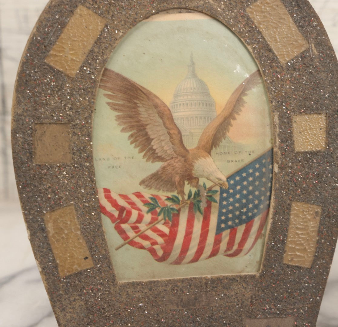 Lot 141 - Antique Patriotic Card "Land Of The Free, Home Of The Brave" In Glittered Horseshoe Frame, 6-1/8" x 8"