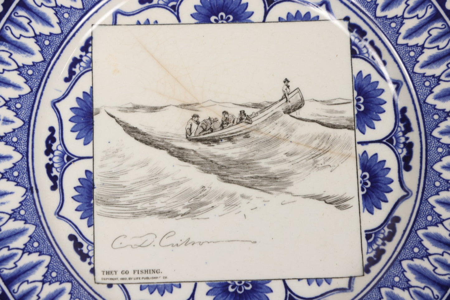 Lot 153 - Pair Of Antique Royal Doulton Decorative Plates With Life Publishing Co. Scenes By Charles Dana Gibson, 1900–1901, Including "They Go Fishing" And "She Goes To The Fancy Dress Ball As 'Juliet'," 10-1/2" Diameter Each